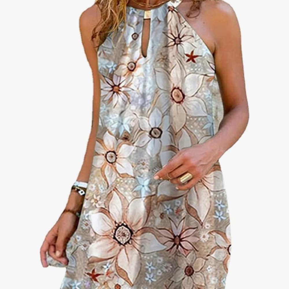 Very cute summer dress with pretty gold detailing around the neck. Size medium
